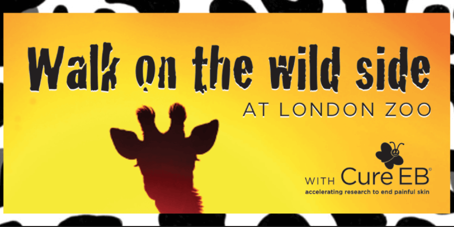 Giraffe in silhouette against sunet with title 'Walk on the wild side at London Zoo' overlaid