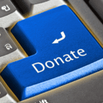 Close up of a computer keyboard with a blue Donate button.