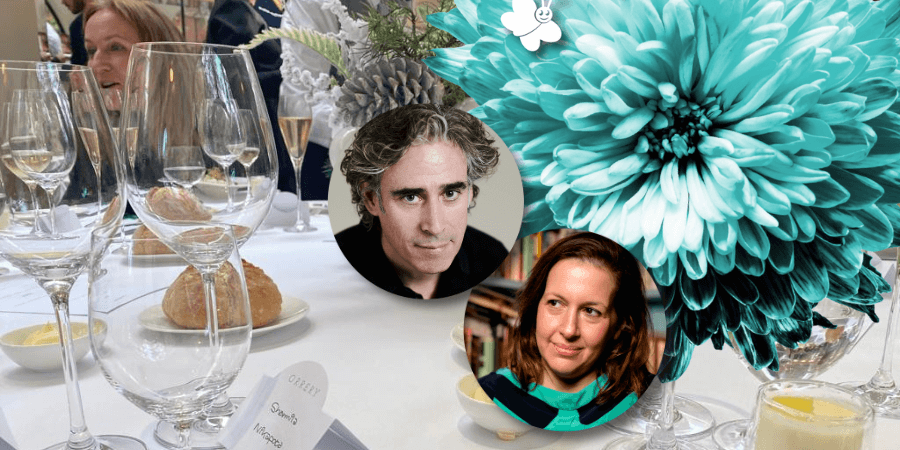 Close up of a restaurant table laid for lunch , overlaid with a blue flower